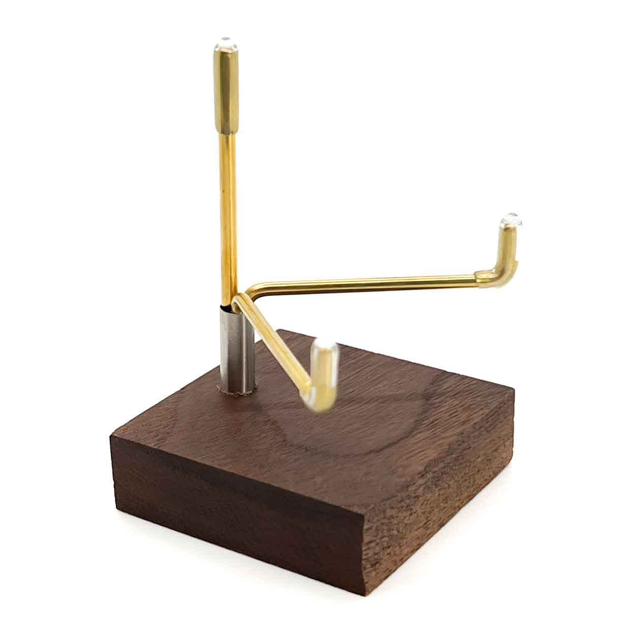Angled view of walnut prong-style display stand.