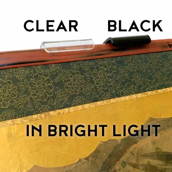 Clear vs Black lucite screen brackets seen in bright light.