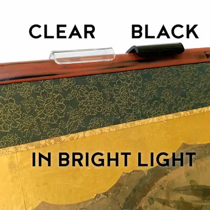 Clear vs Black lucite screen brackets seen in bright light.