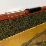 Example of clear and black clips on a red lacquer edge